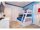 Charming bedroom featuring a bunk bed and playful cartoon-themed accents at 2649 Calistoga Ave, Kissimmee, FL 34741