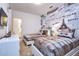 Bedroom with two beds, neutral carpet, and accent wall featuring landmarks like the Eiffel Tower at 2649 Calistoga Ave, Kissimmee, FL 34741
