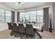 Modern dining room with designer light fixture, stylish furnishings, and a window view at 2649 Calistoga Ave, Kissimmee, FL 34741