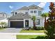 Beautiful two-story home featuring a modern design, a well-maintained yard, and a two-car garage at 2649 Calistoga Ave, Kissimmee, FL 34741