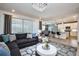 Bright and airy living room with a chandelier, an open kitchen and large windows at 2649 Calistoga Ave, Kissimmee, FL 34741