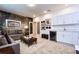 Relaxing living area offers a wet bar and a media area with a modern sofa at 2649 Calistoga Ave, Kissimmee, FL 34741