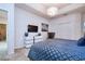 Main bedroom features modern furniture and lighting, plus en suite bathroom and neutral carpet at 2649 Calistoga Ave, Kissimmee, FL 34741