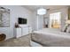 Spacious main bedroom featuring plush carpet, chandelier, and access to the ensuite bathroom at 2649 Calistoga Ave, Kissimmee, FL 34741