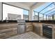 Outdoor kitchen featuring a built-in grill, counter space, and ample cabinet storage at 2649 Calistoga Ave, Kissimmee, FL 34741