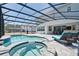 This covered pool with spa has ample lounging space, perfect for relaxation and entertaining at 2649 Calistoga Ave, Kissimmee, FL 34741
