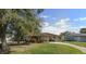 Charming single-story home with a well-maintained lawn and a driveway at 2947 Larson St, Kissimmee, FL 34741