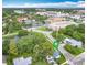 Aerial view of the home with pond and amenities nearby at 302 E Drury Ave, Kissimmee, FL 34744