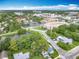 Panoramic aerial view featuring a pond and surrounding neighborhood, showcasing the community's layout at 302 E Drury Ave, Kissimmee, FL 34744