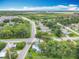 The home is positioned in a neighborhood with mature trees and easy street access at 302 E Drury Ave, Kissimmee, FL 34744
