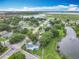 Aerial view of the home with pond and lake nearby at 302 E Drury Ave, Kissimmee, FL 34744