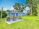 Outdoor patio with a barbecue and seating area, perfect for enjoying the backyard and outdoor living at 302 E Drury Ave, Kissimmee, FL 34744