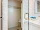 Bathroom featuring a modern vanity and textured shower, with a glass door entry at 302 E Drury Ave, Kissimmee, FL 34744