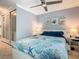 Comfortable bedroom with ceiling fan, decorated with ocean-themed wall art and bedding at 302 E Drury Ave, Kissimmee, FL 34744