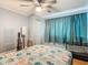 Neutral bedroom featuring a ceiling fan and ample natural light at 302 E Drury Ave, Kissimmee, FL 34744