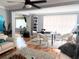 Spacious living area featuring a dining area and plenty of natural light at 302 E Drury Ave, Kissimmee, FL 34744