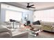 Open living and dining area with ample natural light and modern furnishings at 302 E Drury Ave, Kissimmee, FL 34744