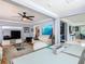Open-concept living room view showcasing the modern design and open floor plan to dining room at 302 E Drury Ave, Kissimmee, FL 34744