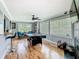 A recreation room featuring hardwood floors, an entertainment center, and a pool table for entertainment at 302 E Drury Ave, Kissimmee, FL 34744