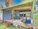 Spacious shed with a covered area providing ample storage for vehicles or other items at 302 E Drury Ave, Kissimmee, FL 34744