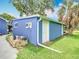 Exterior view of the shed showcasing ample storage space and a well-kept lawn at 302 E Drury Ave, Kissimmee, FL 34744