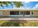 The backyard features a brick paved patio and screened in porch at 3048 Cherokee Rd, St Cloud, FL 34772