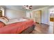 Bedroom featuring a wood floor, and a ceiling fan, providing a comfortable and well-lit area at 3048 Cherokee Rd, St Cloud, FL 34772