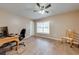 Bedroom featuring hardwood floors, a desk, a chair, and a window at 3048 Cherokee Rd, St Cloud, FL 34772