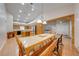 Open-concept dining area flowing into the kitchen, featuring hardwood floors and pendant lighting at 3048 Cherokee Rd, St Cloud, FL 34772