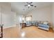 Spacious living room featuring an open layout, vaulted ceilings, and comfortable sectional seating at 3048 Cherokee Rd, St Cloud, FL 34772