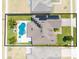 Aerial view shows the layout of the home with a fenced in yard, pool and spa at 3101 Drema Dr, St Cloud, FL 34769