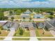 An aerial view showcasing a well maintained home with solar panels in a well manicured neighborhood at 3101 Drema Dr, St Cloud, FL 34769