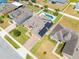Gorgeous home with a sparkling pool, lush landscaping, solar panels, and a paver driveway at 3101 Drema Dr, St Cloud, FL 34769