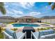 Beautiful outdoor pool with a spa, fire pit, and plenty of space to entertain and relax at 3101 Drema Dr, St Cloud, FL 34769