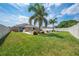 Expansive backyard featuring manicured lawn and privacy fence for a serene outdoor setting at 3101 Drema Dr, St Cloud, FL 34769