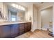Bathroom boasts double sinks with granite countertops and wood cabinets at 3101 Drema Dr, St Cloud, FL 34769