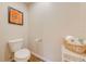 Cozy powder room features wood flooring and a fun sports theme at 3101 Drema Dr, St Cloud, FL 34769