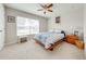 Bedroom featuring neutral walls and carpet, a ceiling fan, and a window with blinds at 3101 Drema Dr, St Cloud, FL 34769