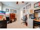 Bedroom with beige carpet, ceiling fan, and decorated with sports memorabilia at 3101 Drema Dr, St Cloud, FL 34769