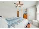 Comfortable bedroom with neutral walls, carpet, and a ceiling fan for added comfort at 3101 Drema Dr, St Cloud, FL 34769