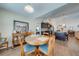 Dining area with a round table, seating for four, and a view into the kitchen at 3101 Drema Dr, St Cloud, FL 34769