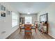 Formal dining room with a round table, seating for six, and large windows at 3101 Drema Dr, St Cloud, FL 34769