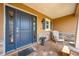 Inviting covered front porch with stone accents and a comfortable seating area at 3101 Drema Dr, St Cloud, FL 34769