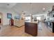 Bright, open kitchen features a large island, stainless steel appliances, and hardwood floors at 3101 Drema Dr, St Cloud, FL 34769