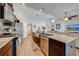 The kitchen boasts stainless steel appliances, a breakfast bar, and wood-look tile flooring at 3101 Drema Dr, St Cloud, FL 34769