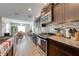 Kitchen featuring modern stainless steel appliances, granite countertops, and ample cabinet space at 3101 Drema Dr, St Cloud, FL 34769