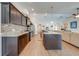 Open kitchen with stainless steel appliances, a central island, and a mosaic tile backsplash at 3101 Drema Dr, St Cloud, FL 34769