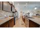 Kitchen with stainless steel appliances, tile backsplash, granite countertops, and breakfast bar at 3101 Drema Dr, St Cloud, FL 34769