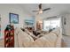 Cozy living room with a large sectional sofa and sliding glass doors to the outdoor patio at 3101 Drema Dr, St Cloud, FL 34769