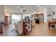 Open-concept living space with wood-look tile flooring and a view of the kitchen at 3101 Drema Dr, St Cloud, FL 34769